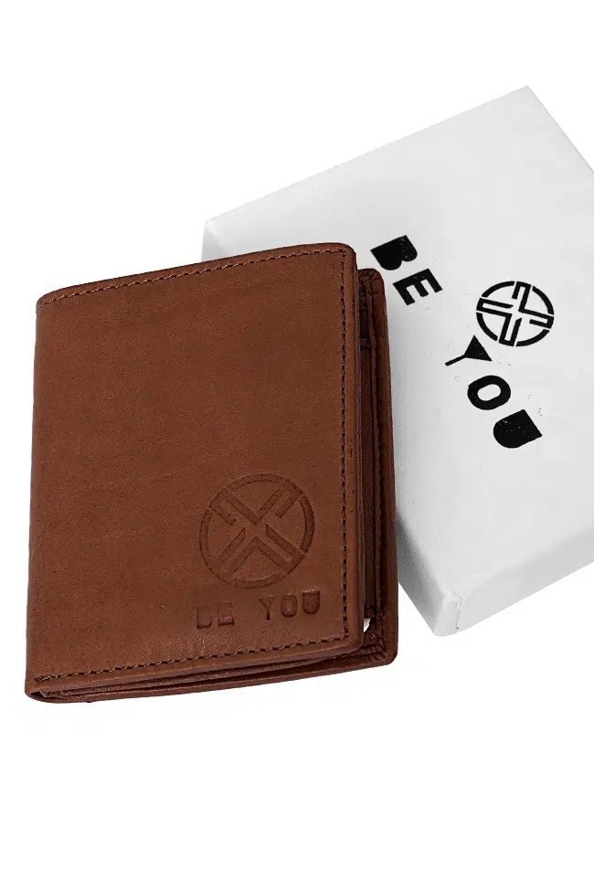 Tan brown leather wallet placed on white Be You branded gift box